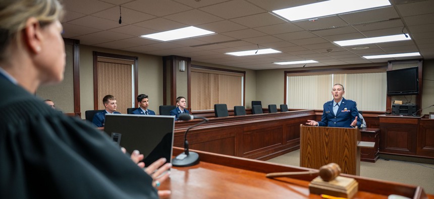 A judge advocate speaks to a judge, July 3, 2025, at Malmstrom Air Force Base, Mont. 