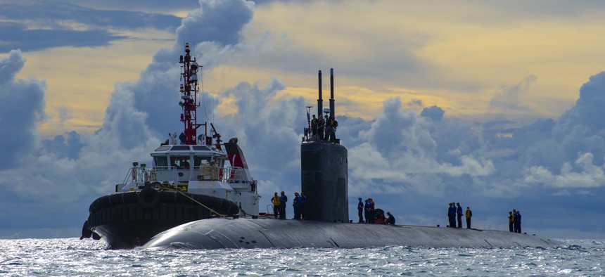  USS Hampton, a Los Angeles-class fast attack submarine, approaches the island of Saipan of the Northern Mariana Islands in this 2021 photo.