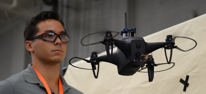SHIELD AI co-founder Brandon Tseng shows off the NOVA drone to Army acquisition leaders.
