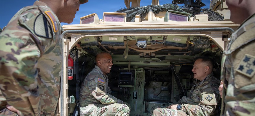 Gen. Ronald Clark, left, commander of U.S. Army Pacific, and Maj. Gen. Patrick Ellis, commander of 4th Infantry Division, discuss Next-Generation Command and Control technology at Fort Carson, Colorado, Apr. 15, 2026.