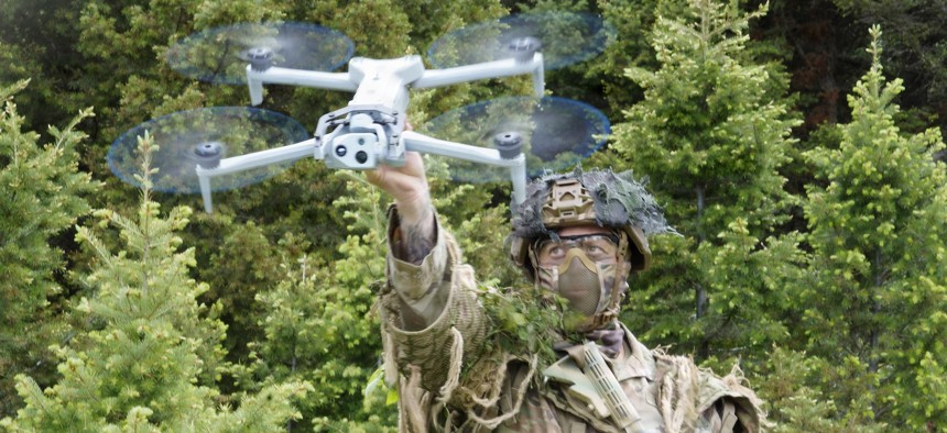 Spc. Justin Regis launches a Skydio drone during BattleLab 26.2 near Bozeman, Montana, June 8, 2026. 