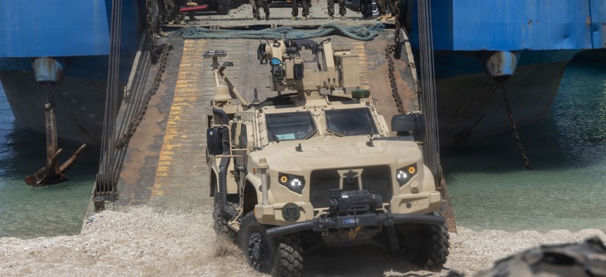 Marines drive a Marine Air Defense Integrated System off a Philippine surface connector during KAMANDAG 10 at Calayan, Philippines, June 22, 2026. 