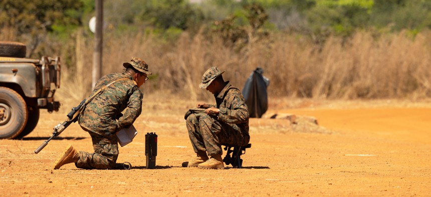 U.S. Marine riflemen with 5th Marine Regiment conduct radio communication training on Aug. 9, 2023, at the Base Expedicionaria de Fuzileiros Navais in Formosa, Brazil.
