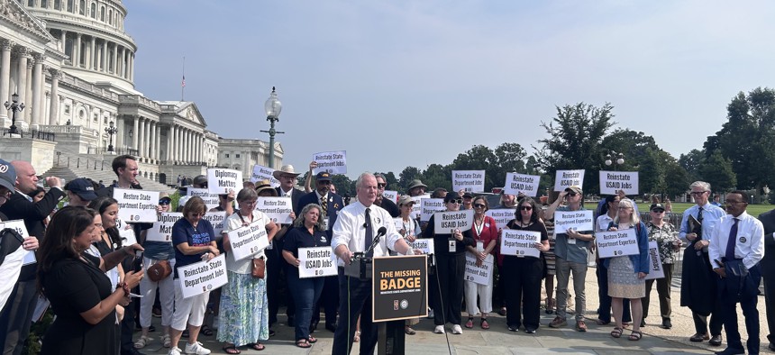 Sen. Chris Van Hollen, D-Md., speaks at a press conference on Thursday in front of the Capitol Building against layoffs at the State Department.