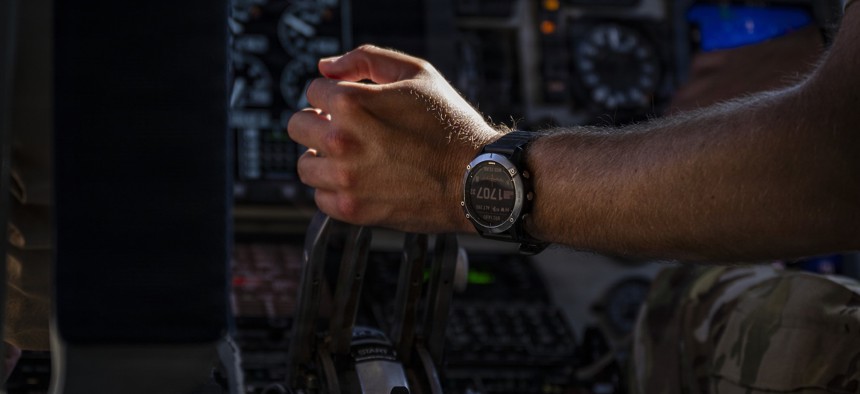 A pilot grips the throttle aboard a U.S. Air Force KC-135 Stratotanker aircraft in the U.S. Central Command area of responsibility July 22, 2026.