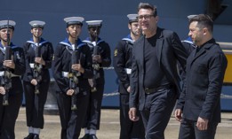 Britain's Prime Minister Andy Burnham walks with Ukraine's President Volodymyr Zelensky (R) at a welcoming ceremony, during their visit to HM Naval Base in Portsmouth, England on July 27, 2026. 