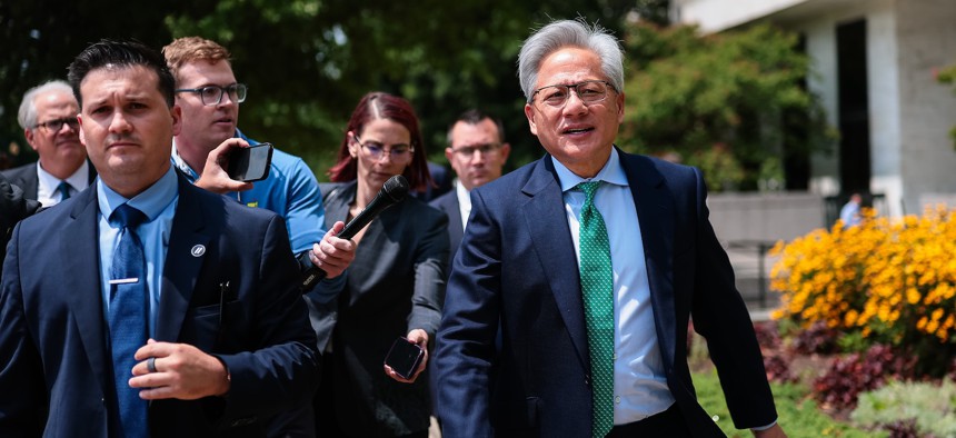 Nvidia CEO Jensen Huang talks to members of the press as he leaves the Hart Senate Office Building on July 28, 2026.