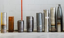 Artillery shells at various stages of production were displayed at General Dynamics' factory in Mesquite, Texas, when it opened. 