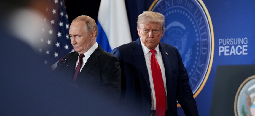 U.S. President Donald Trump (R) and Russian President Vladimir Putin arrive for a press conference at Joint Base Elmendorf-Richardson on August 15, 2025 in Anchorage, Alaska. 
