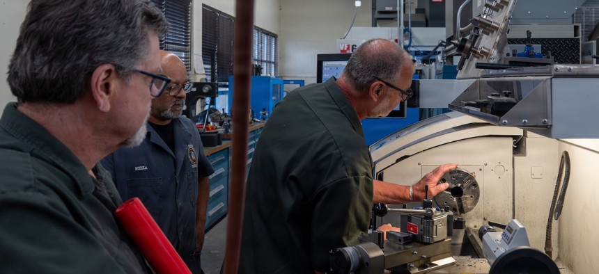 Training Device Design and Engineering Center engineering technicians work with a manual turning center at Vandenberg Space Force Base, California, June 30, 2026.