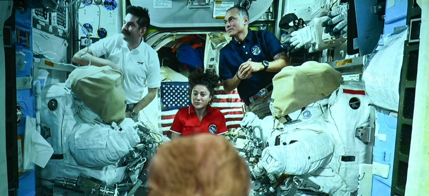 President Donald Trump looks on as crew members on the International Space Station (ISS) are displayed on a screen at the Mission Control Center at NASA Lyndon B. Johnson Space Center in Houston, Texas, on August 28, 2026.