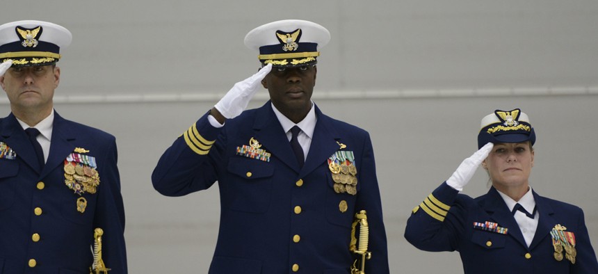 Then-Cmdr. Ronzelle Green renders a salute during the presentation of colors at the Coast Guard Port Security Unit 308 change of command ceremony, Dec. 5, 2015.