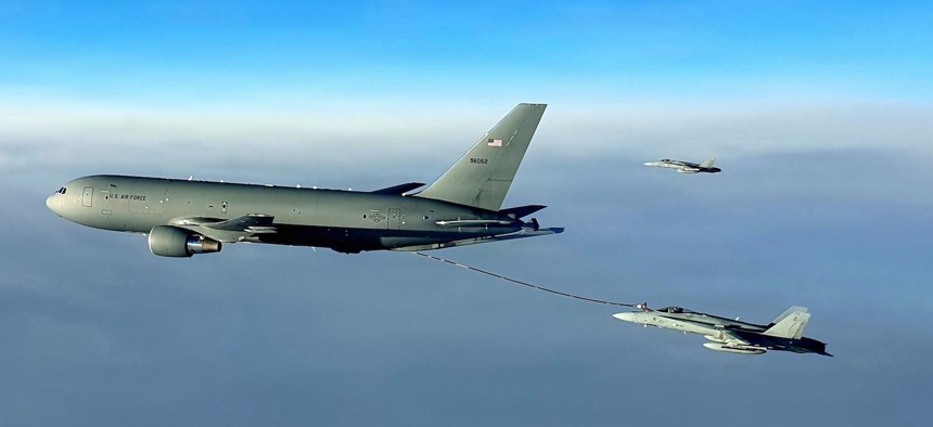 A U.S. Air Force Reserve Command’s KC-46 Pegasus refuels Finnish F/A-18s in Finland airspace, Dec. 7, 2022.