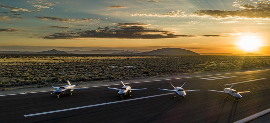 A photograph of several FQ-42 aircraft sitting on a runway. Image courtesy of GA-ASI. 