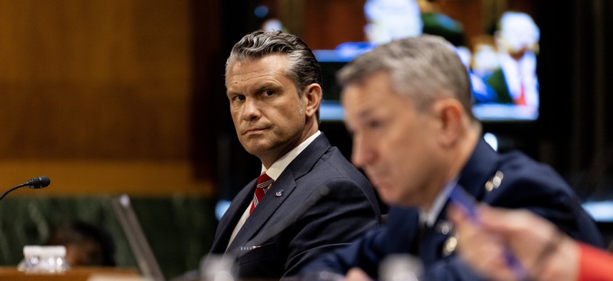 Defense Secretary Pete Hegseth and Gen. John Caine testify before a Senate committee in Washington, D.C., on July 21, 2026.