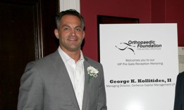George K. Kollitides II, left, at a party honoring him at The Harvard Club in New York on July 13, 2010.