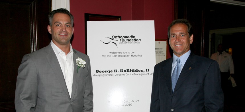 George K. Kollitides II, left, at a party honoring him at The Harvard Club in New York on July 13, 2010.