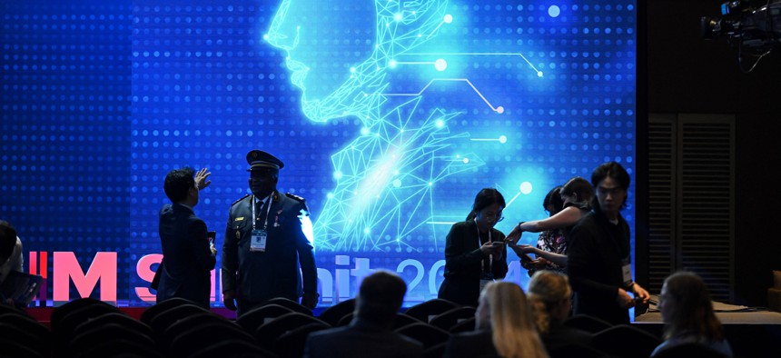 Participants chat at the closing session of the Responsible AI in the Military Domain (REAIM) summit in Seoul on September 10, 2024. 