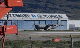 A Royal Danish Air Force transport plane stands on the tarmac next to a hangar of the Joint Arctic Command on July 14, 2026, in Kangerlussuaq, Greenland.