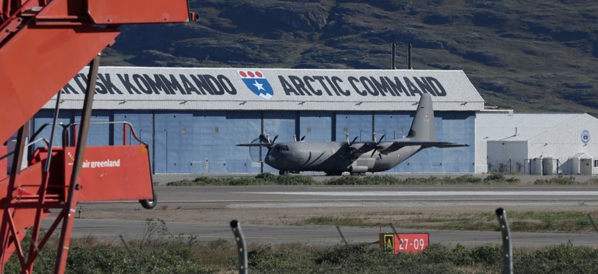 A Royal Danish Air Force transport plane stands on the tarmac next to a hangar of the Joint Arctic Command on July 14, 2026, in Kangerlussuaq, Greenland.