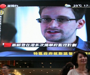 A photograph of NSA leaker Edward Snowden on a screen in Hong Kong