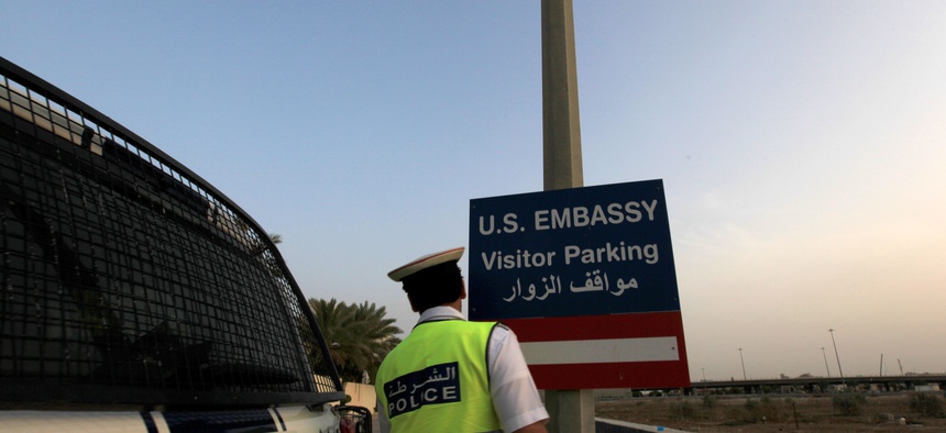 A policeman in Baharain patrols a checkpoint at a road leading to U.S. Embassy Manama