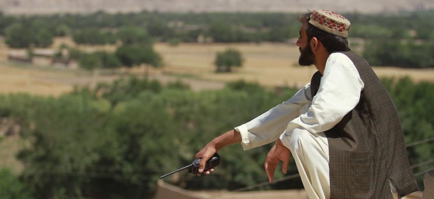 An Afghan Local Police commander conducts watch in Sangin earlier this year.
