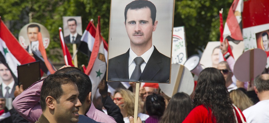 Syrians rally in support of the Assad regime at The Hague in Holland last year.