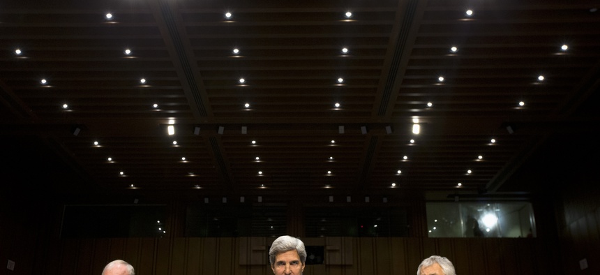 Secretary of State John Kerry, Secretary of Defense Chuck Hagel, and Chairman of the Joint Chiefs of Staff Martin Dempsey at a Senate Foreign Relations Committee hearing