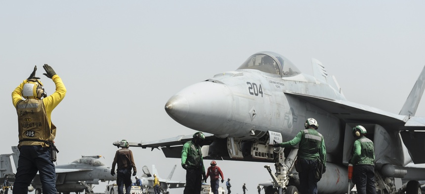An F/A-18E Super Hornet prepares to launch from the flight deck of the aircraft carrier USS Nimitz in the Red Sea on Tuesday.