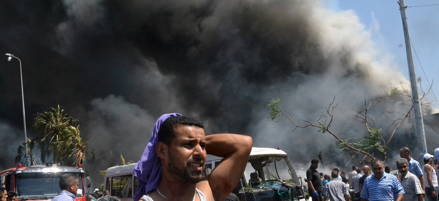 A man reacts after a car bomb attack in Tripoli, Lebanon