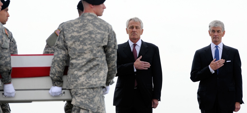 Defense Secretary Chuck Hagel and Army Secretary John McHugh at Dover AFB on Wednesday for the homecoming of four soldiers killed in Afghanistan this weekend.
