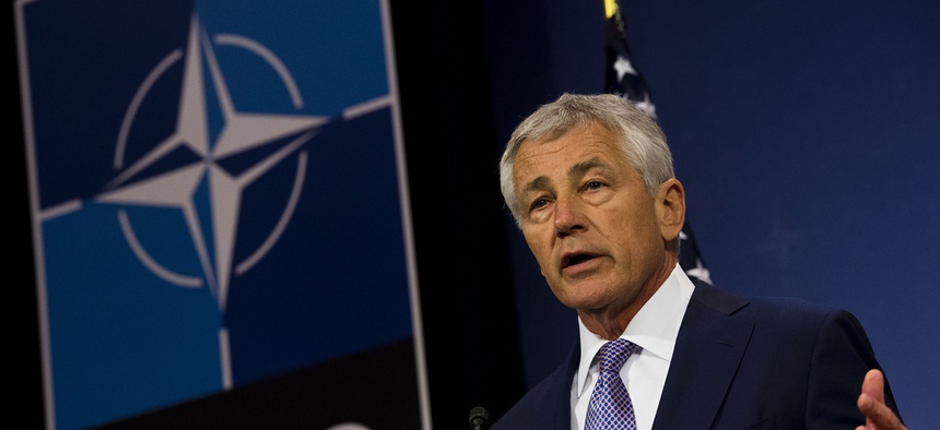Defense Secretary Chuck Hagel briefs the press at a NATO meeting in Brussels in June.