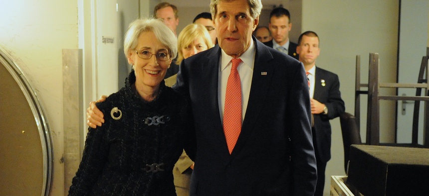 Secretary of State John Kerry with Under Secretary of State for Political Affairs Wendy Sherman after the P5+1 reached a nuclear deal with Iran in Geneva, Switzerland, Nov. 24, 2013.