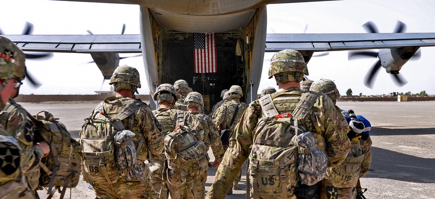 Soldiers board an Air Force C-130 bound for Joint Base Lewis-McChord