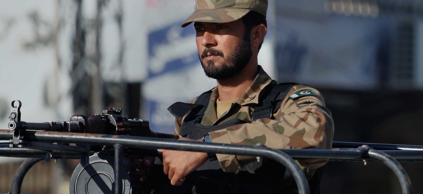 A Pakistani soldier stands guard during a curfew in Rawalpindi, Pakistan