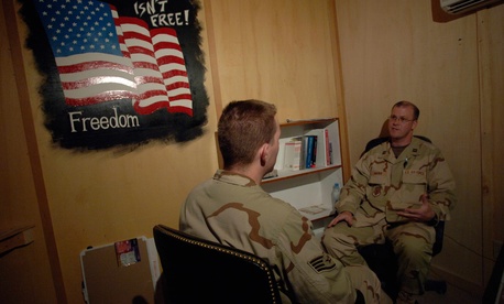 A staff psychiatrist in Kandahar, Afghanistan, evaluates a soldier A staff psychiatrist in Kandahar, Afghanistan, evaluates a soldier