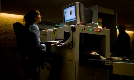 Passengers have their luggage screened by security personnel inside the Ben Gurion airport terminal near Tel Aviv, Israel, November 2010. Passengers have their luggage screened by security personnel inside the Ben Gurion airport terminal near Tel Aviv, Israel, November 2010.