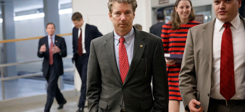 Sen. Rand Paul, R-Ky, heads to the Senate floor to advance a bill supporting aid to Ukraine