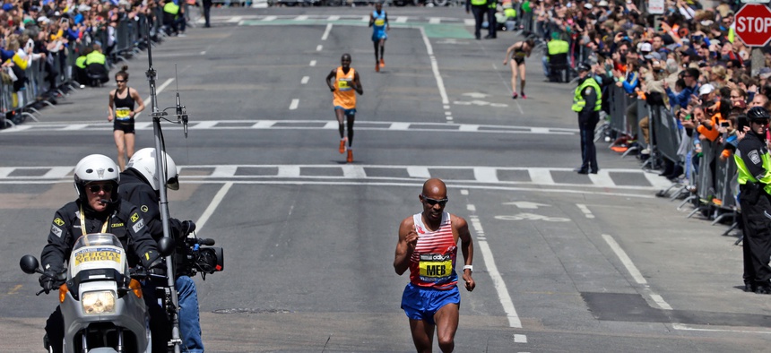 Meb Keflezighi runs the final few blocks before winning the 118th Boston Marathon Monday, April 21, 2014 in Boston.