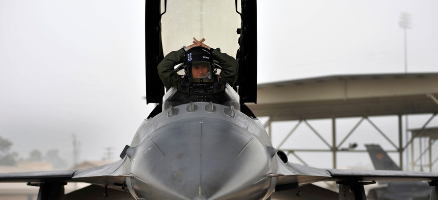A U.S. Air Force Captain with the 55th Fighter Squadron prepares his cockpit in his F-16 prior to takeoff from Shaw Air Force Base, South Carolina