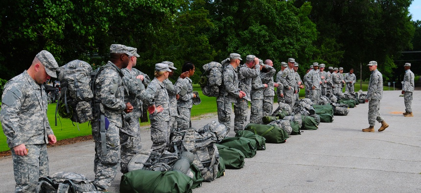 Officer Candidate School cadre greet new candidates arriving to Fort McClellan, Ala., July 19, 2013.