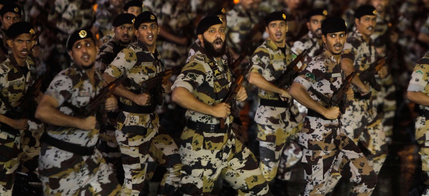 Saudi military soldiers march during a military parade marking the Hajj in October 2013