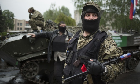 Pro-Russian gunmen guard the central square of Slovyansk, eastern Ukraine, Friday, May 2, 2014. Pro-Russian gunmen guard the central square of Slovyansk, eastern Ukraine, Friday, May 2, 2014.