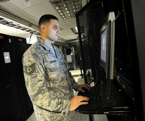 A non-commissioned officer with the 627th Communications Squadron works on a computer system at Joint Base Lewis-McChord in Washington A non-commissioned officer with the 627th Communications Squadron works on a computer system at Joint Base Lewis-McChord in Washington