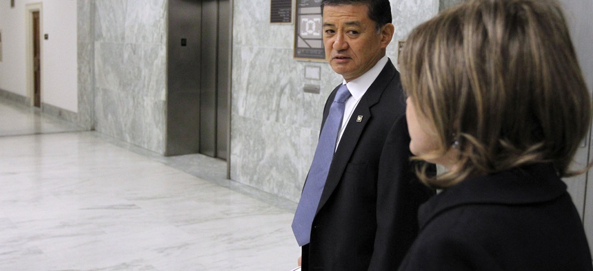 Veterans Affairs Secretary Eric Shinseki waits for an elevator at the Rayburn House Office Building on Capitol Hill.