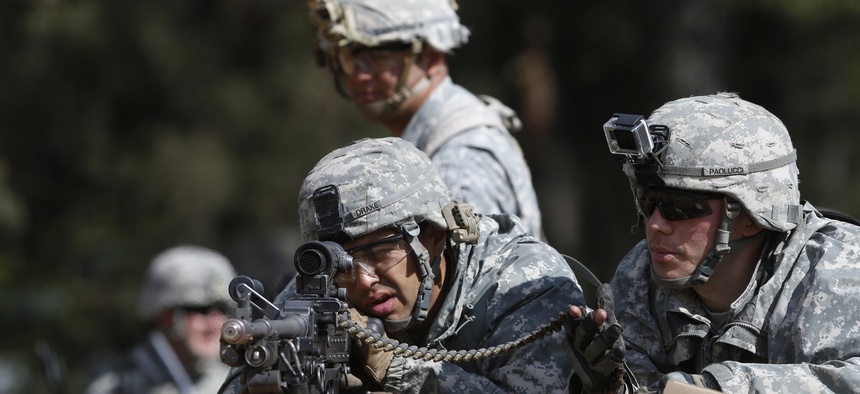 Members of the 173rd Airborne Brigade practice during exercise Black Arrow 2014 at Rukla military base in Lithuania on May 14, 2014.