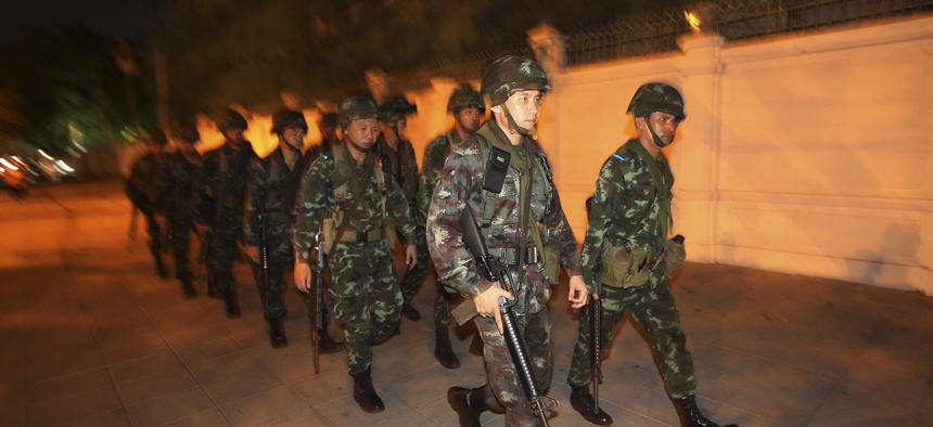 Thai soldiers patrol near an anti-government demonstration in Bangkok on May 22, 2014.