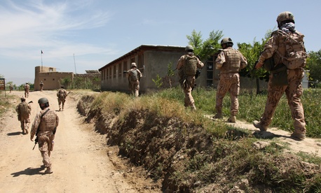 Army soldiers from the Czech Republic and the U.S. Army’s 1st Mechanized Company, 41st Battalion, 4th Rapid Deployment Brigade, patrol through the village of Dehe-Qadzi in Parwan province on Tuesday.