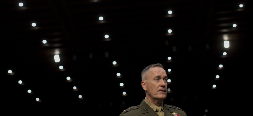 ISAF Commander Gen. Joseph Dunford Jr. arrives for a hearing on Capitol Hill on March 12, 2014.